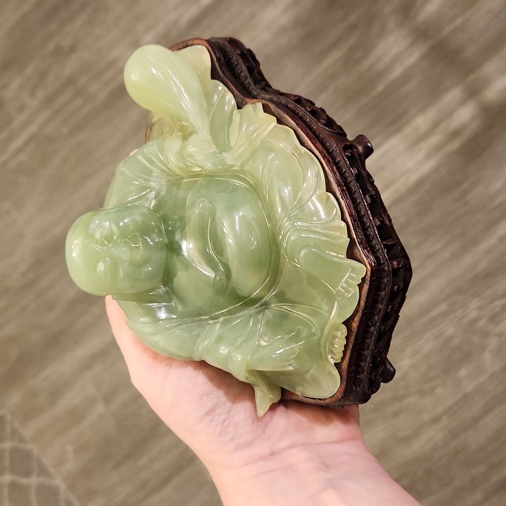 Green stone laughing buddha